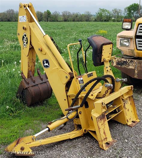 ENCLOSED CAB WITH HEATER , 4 WHEEL DRIVE , SKID STEER QUICK COUPLER WITH 77’’ FRONT BUCKET , FRONT AND REAR AUXILIARY HYD. . John deere backhoe attachment for sale near me
